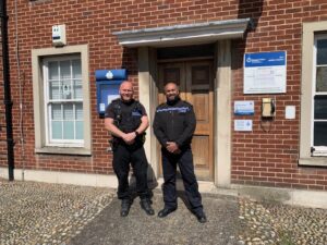 Police Constable Paul Fielder and Chief Inspector Jay Mendis-Gunasekera outside Rye police station